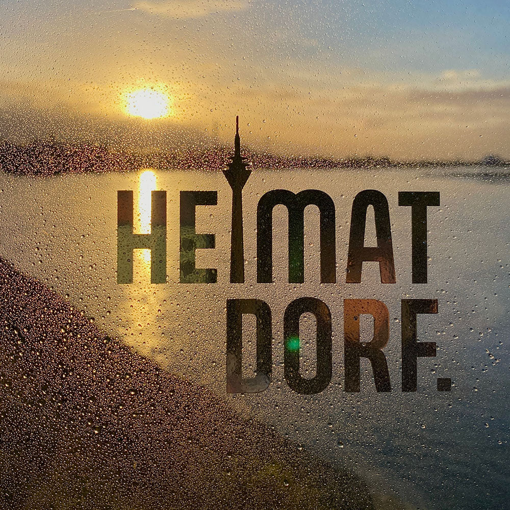 Der Düsseldorf HEIMATDORF Aufkleber im Sonnenuntergang