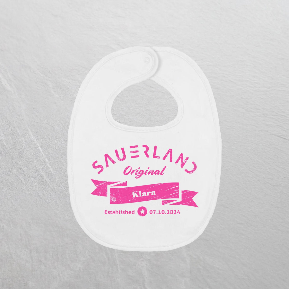 Produktfoto des Sauerland Baby lätzchen in weiß und pink